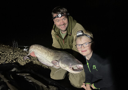 Father and son with a grey 30lb catfish