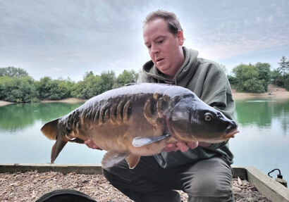 Rob with this stunning carp which only weighed 14lb. Great photography!!